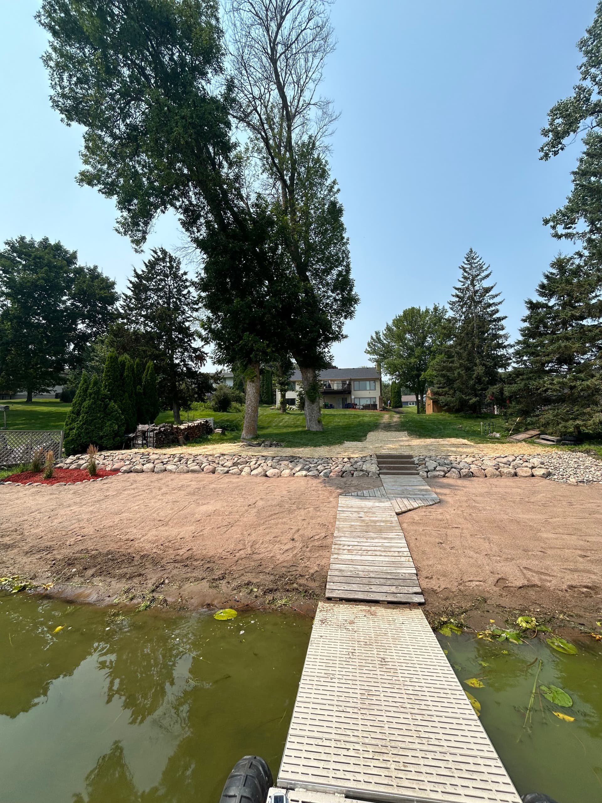 Lakeside Makeover with Boulder Walls and Landscaping