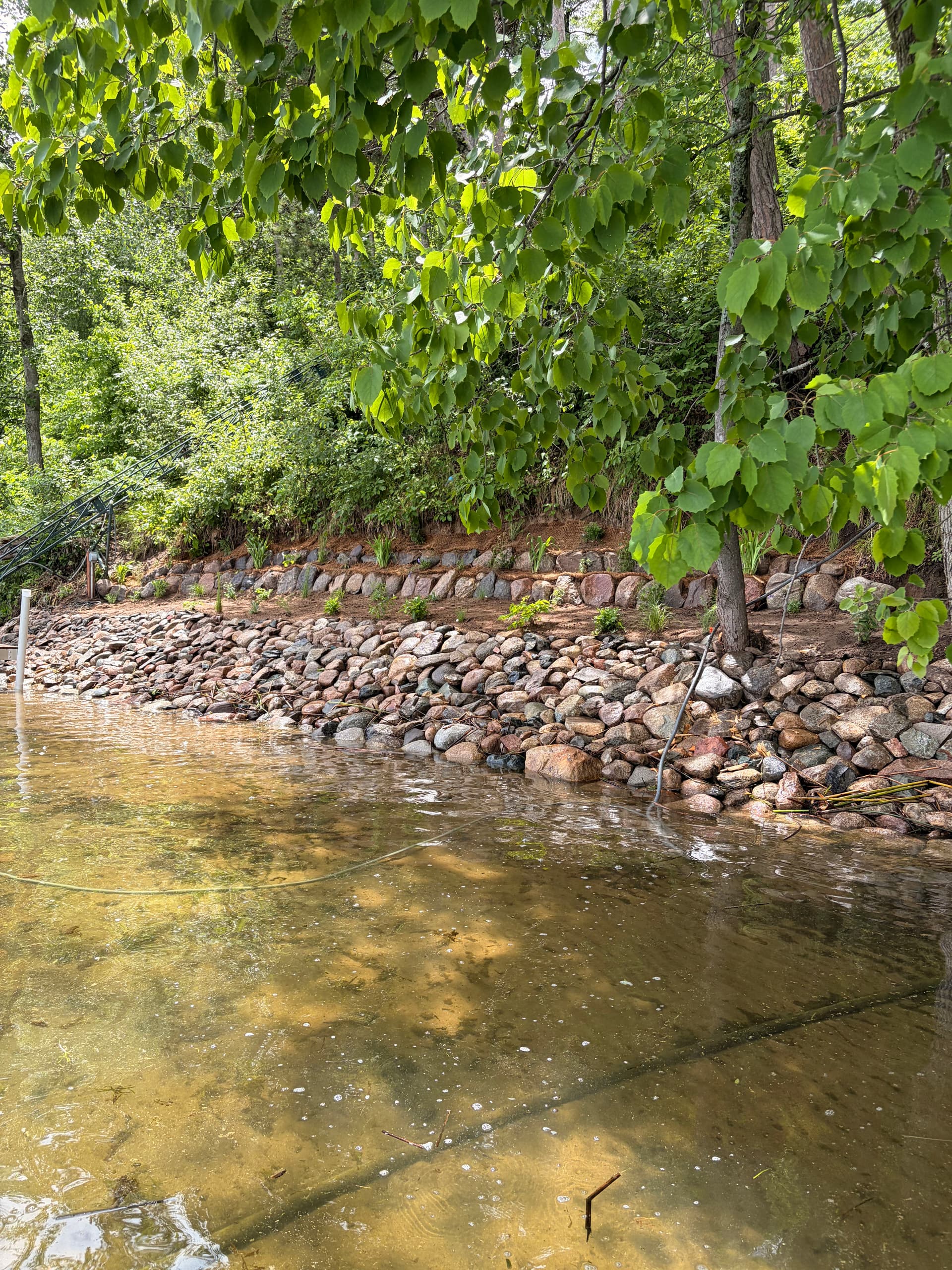 Hand-Placed Riprap Shoreline Restoration on a Steep 140-Foot Bluff image