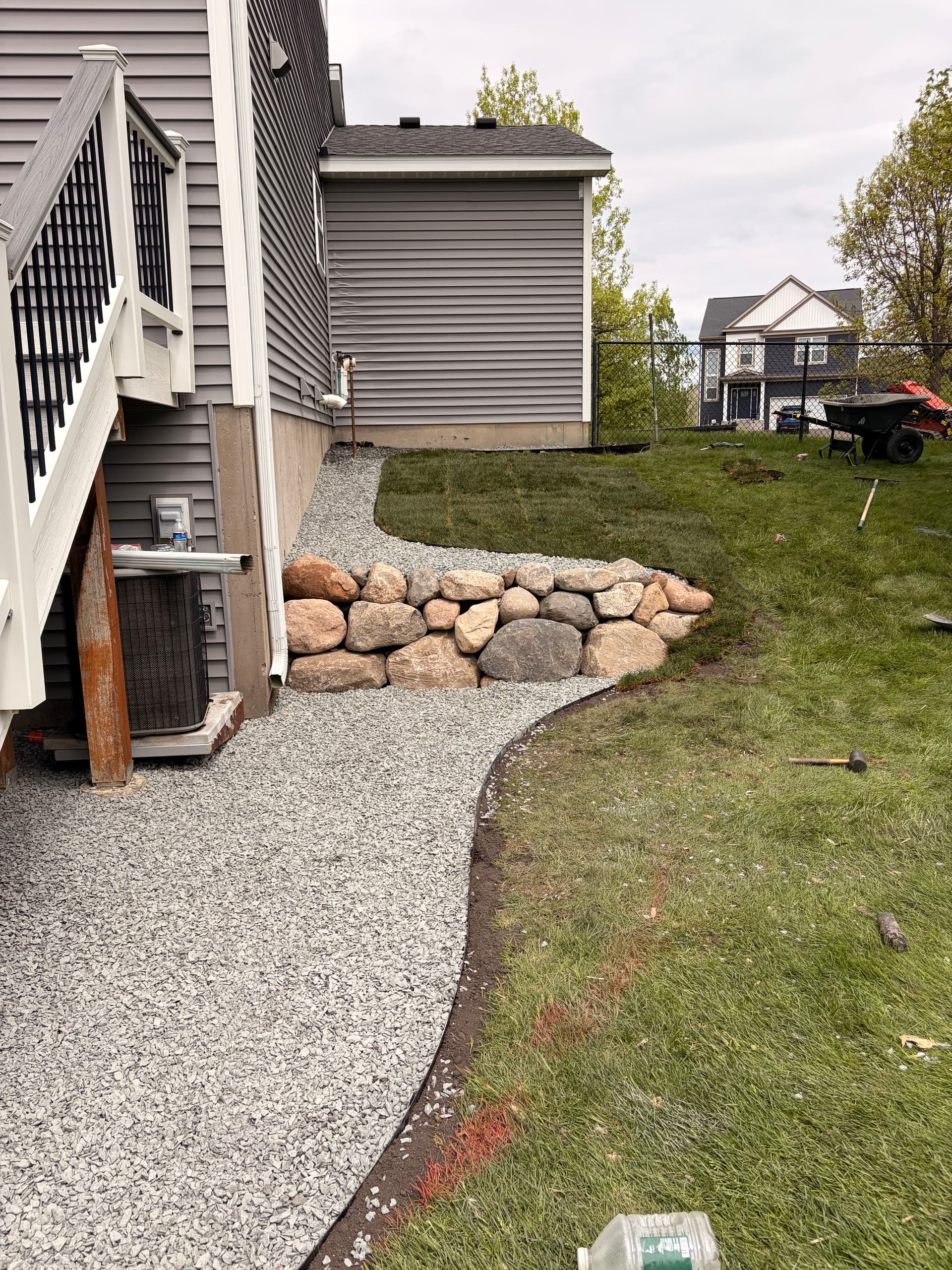 Gallery photos for Backyard Boulder Wall and Gravel Landscaping Done Right: Image #1