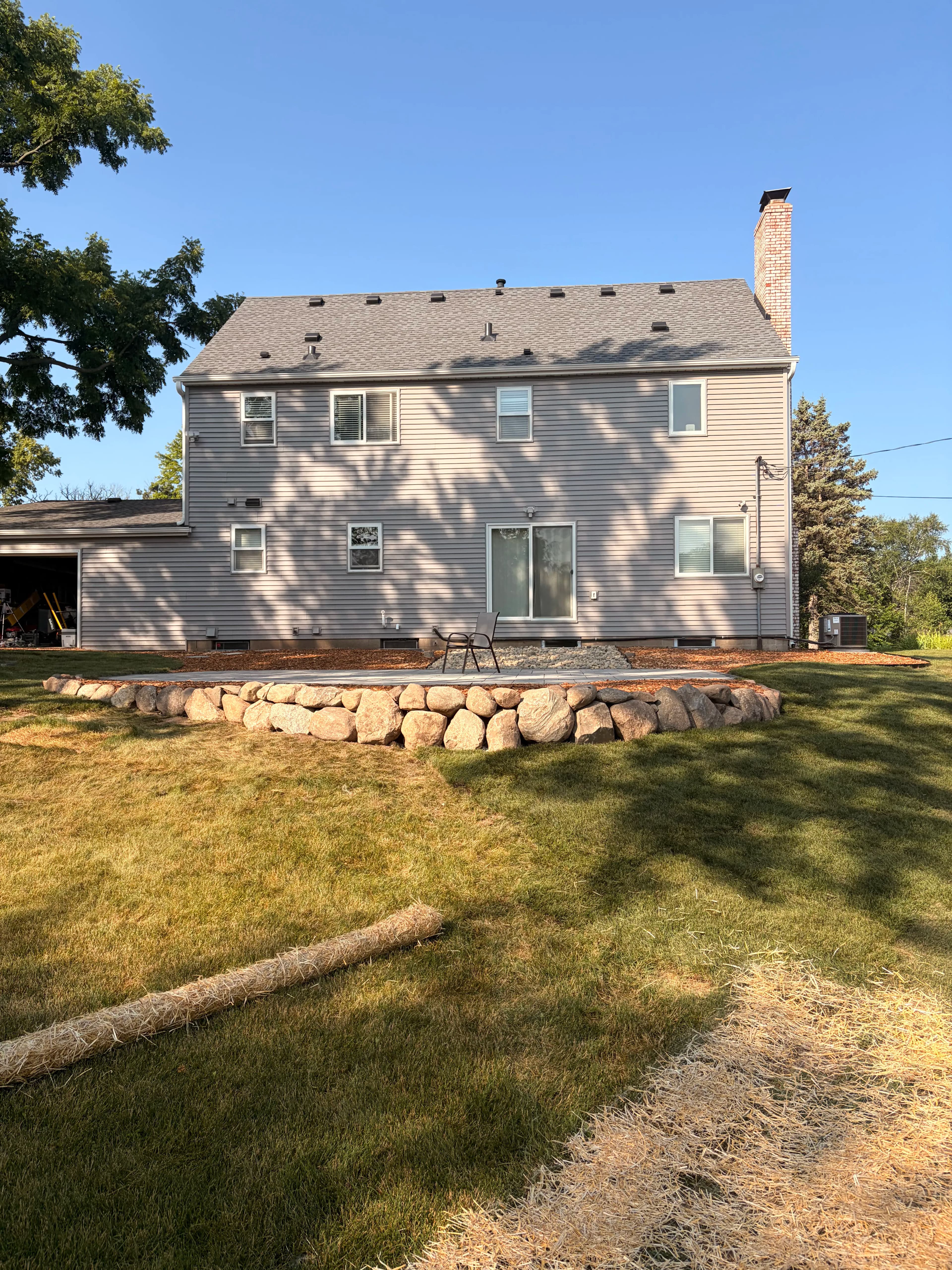 Project Unilock Patio, Boulder Wall, and Backyard Regrade - Phase 1 Complete image