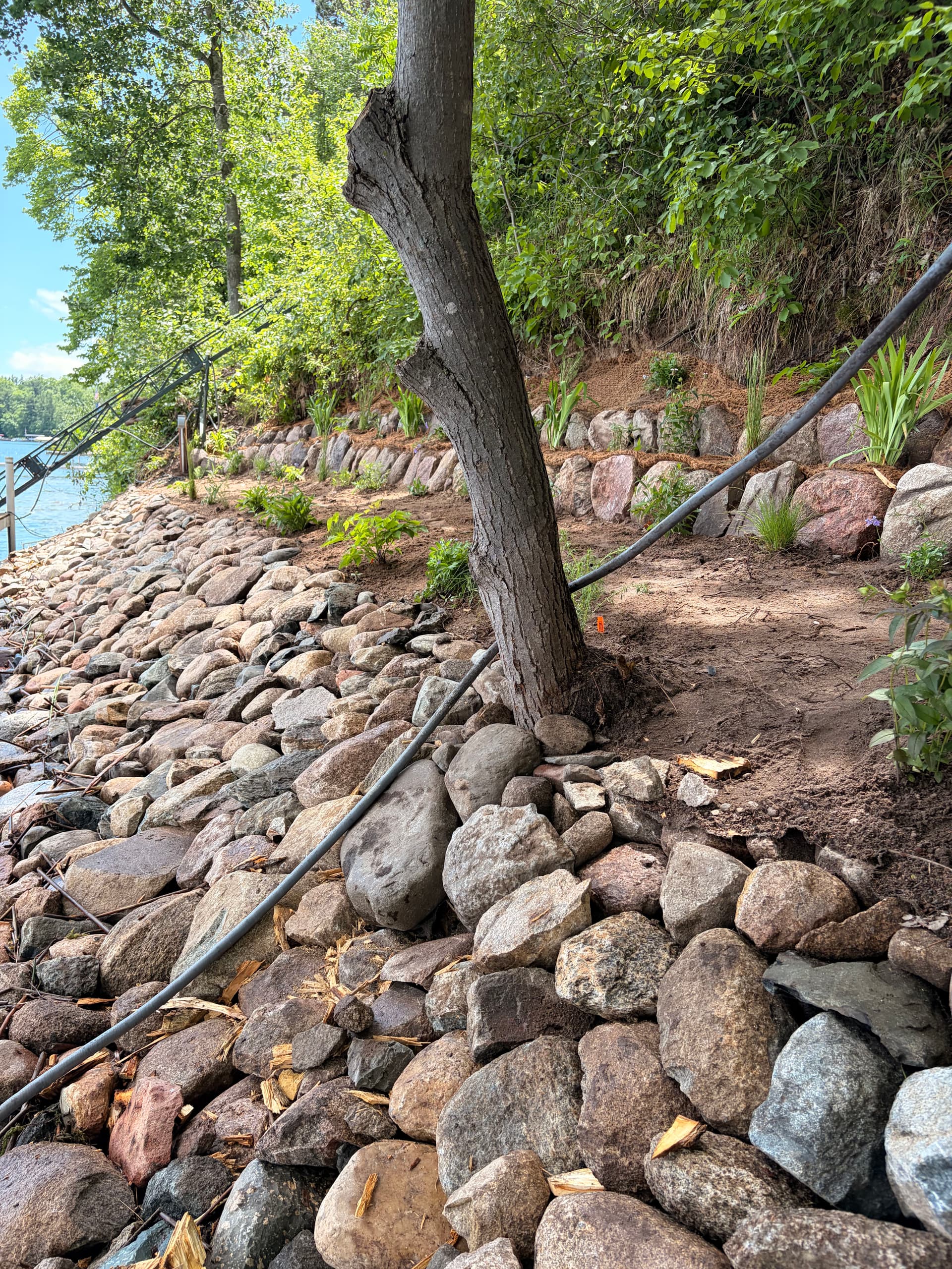 Gallery photos for Hand-Placed Riprap Shoreline Restoration on a Steep 140-Foot Bluff: Image #1